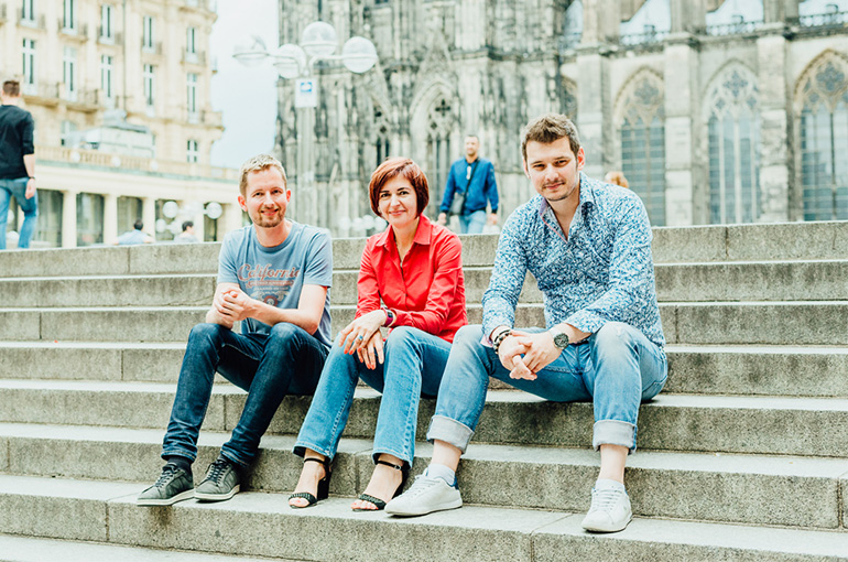 The three trimplement co-founders Thijs Reus, Natallia Martchouk and Matthias Gall having a conversation 